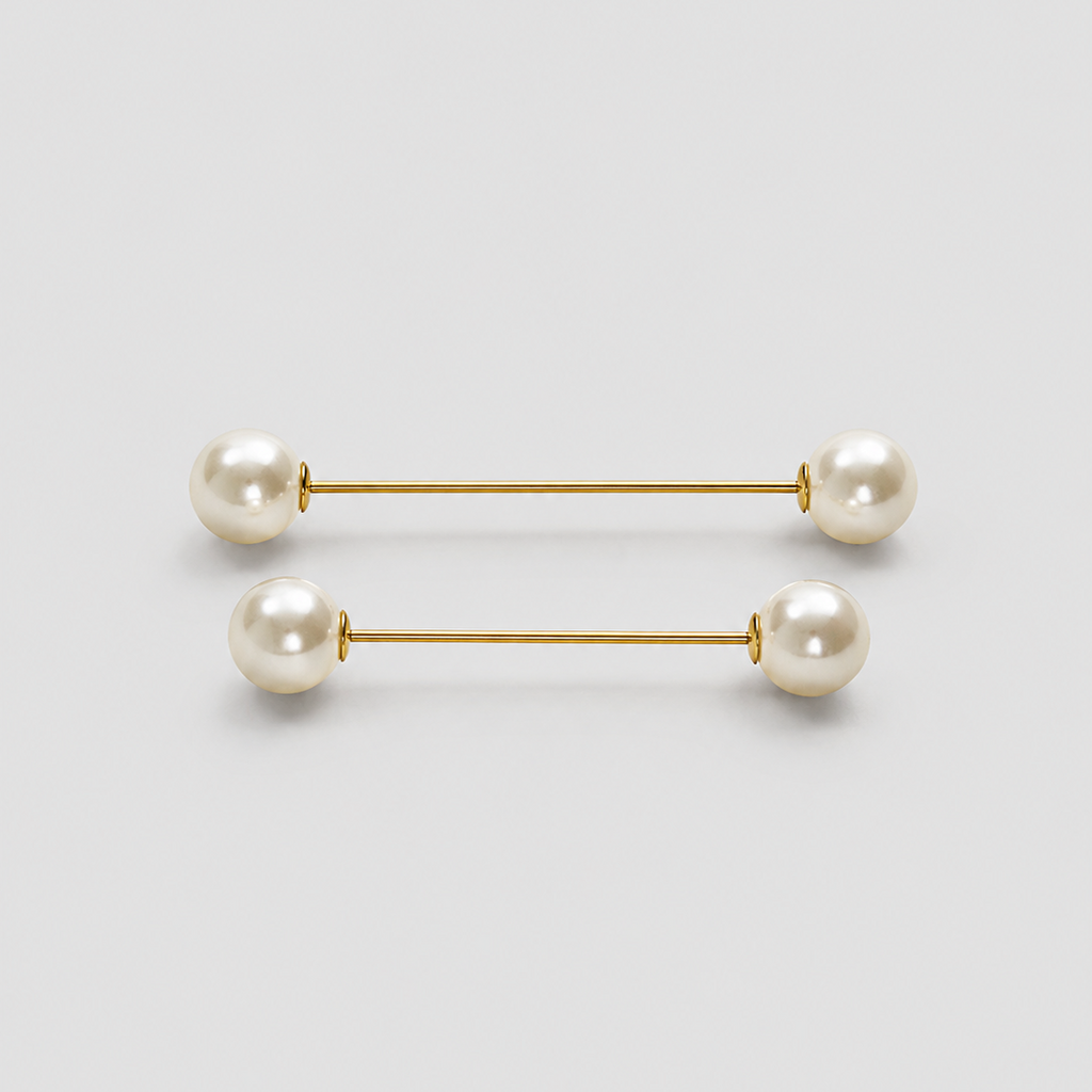 A pair of gold bar earrings with white pearl beads at each end, displayed on a clean light gray background.