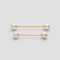 A pair of gold bar earrings with white pearl beads at each end, displayed on a clean light gray background.