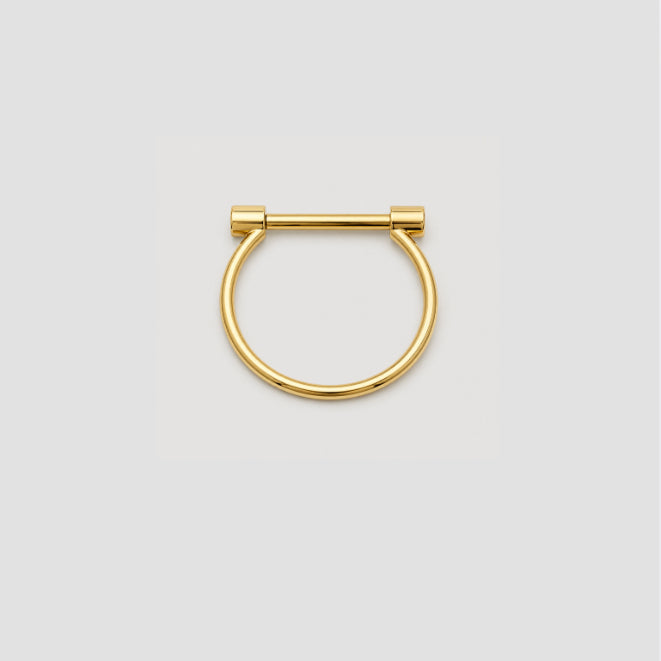 A gold-plated metal screw bracelet, shown against a solid light gray background.
