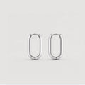 A pair of polished silver hoop earrings with a rounded, elongated oval shape, displayed on a clean light gray background.