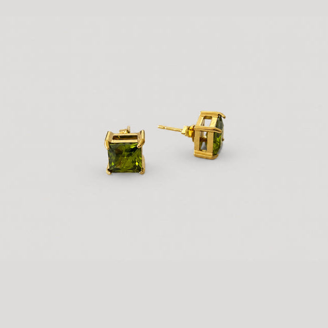 A pair of gold stud earrings with square-cut green gemstones, shown from both front and side angles on a light gray background.
