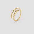 A polished gold wrap ring with a modern, open spiral design, shown on a neutral light gray background.