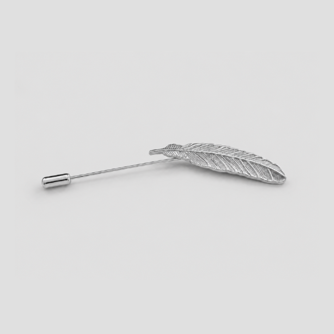 A silver feather-shaped pin with a straight post and a small round end cap, shown on a plain light gray background.